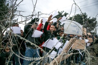 Refugees from Iran, Bangladesh and Pakistan asking to cross the border from Greece into Macedonia