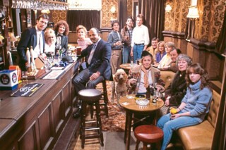 The cast of EastEnders in the Queen Vic (1985).