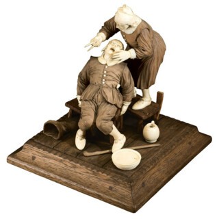 A 17th-century ivory tooth-pulling scene