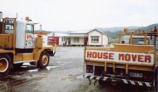 Timber-frame houses in a storage yard