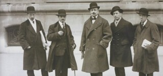 Marinetti is in the middle; Russolo and Carrà are to his right; Boccioni and Severini to his left.