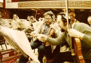 Alan Smyth (centre) and a colleague discuss the score at a recording session not with the Beatles