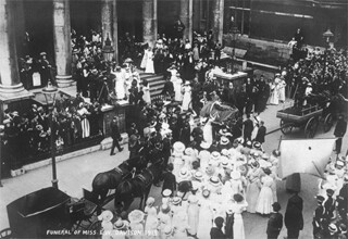 Emily Davison’s coffin outside St George’s, Bloomsbury, saluted by the suffragette guard of honour.