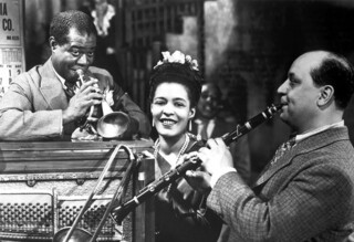 Billie Holiday with Louis Armstrong and Barney Bigard in 1947.