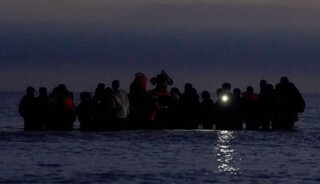 People in the sea near Gravelines in France, presumed to be preparing to cross to the UK, 19 September 2025 (Gareth Fuller / PA / Alamy)