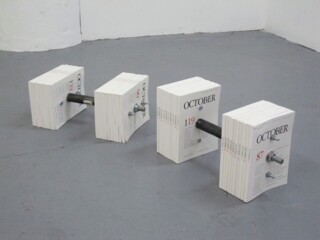Dumbbells (October Journals and Hardware, 9” x 7” x 19” each, 2010) by Erik Benjamins