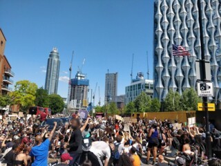 Protesters take a knee outside the US Embassy in London on 31 May
